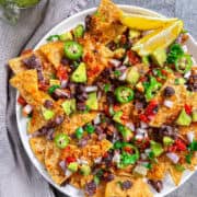 The Ultimate Loaded Vegan Nachos with ground beef in pan