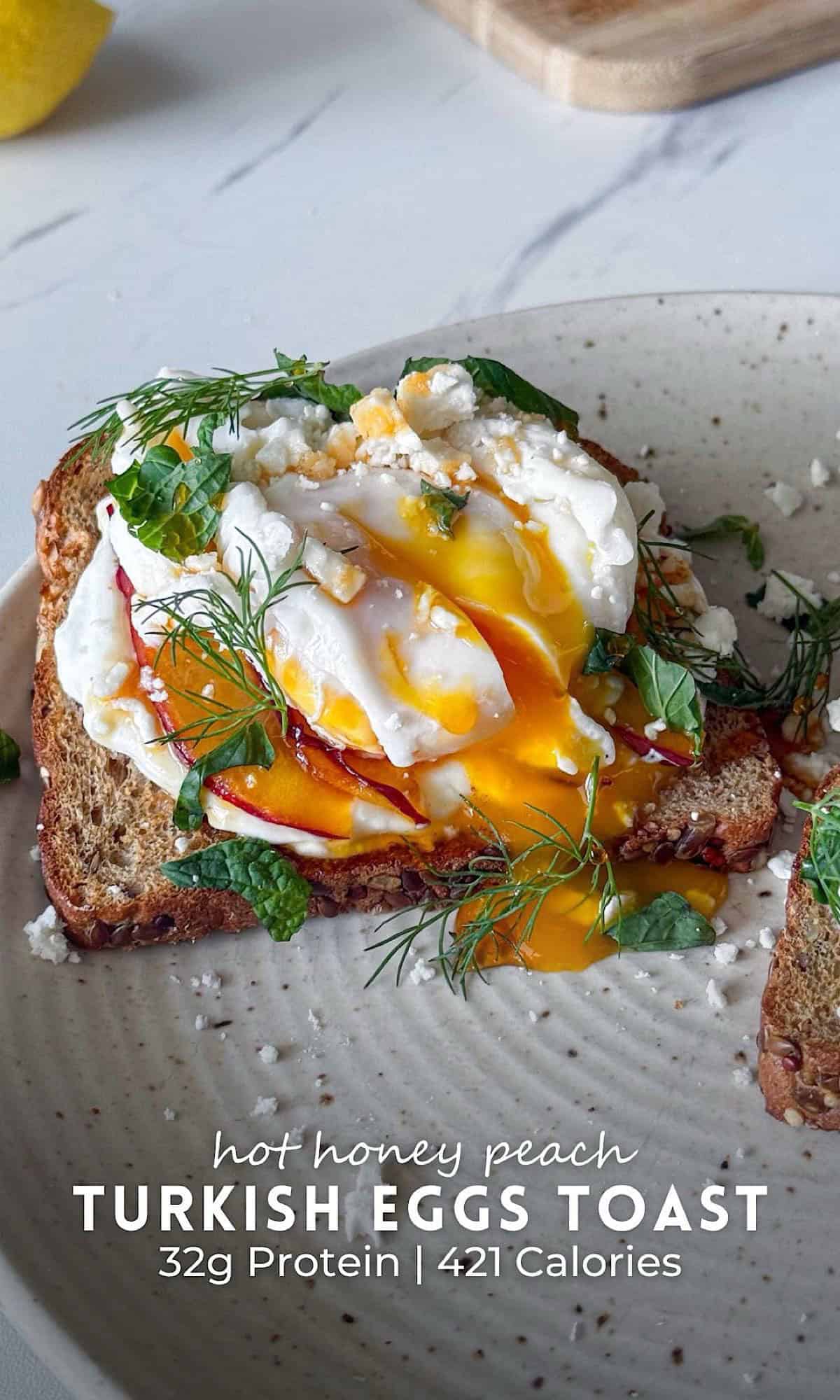 Hot Honey Peach Turkish Eggs Toast 10 Hot honey peach Turkish eggs toast topped with creamy yogurt, juicy peach slices, jammy eggs, crumbled feta, fresh herbs, and a drizzle of hot honey on hearty seeded toast. Bright golden egg yolk spills over the toast, creating a sweet and savory breakfast packed with color and texture.
